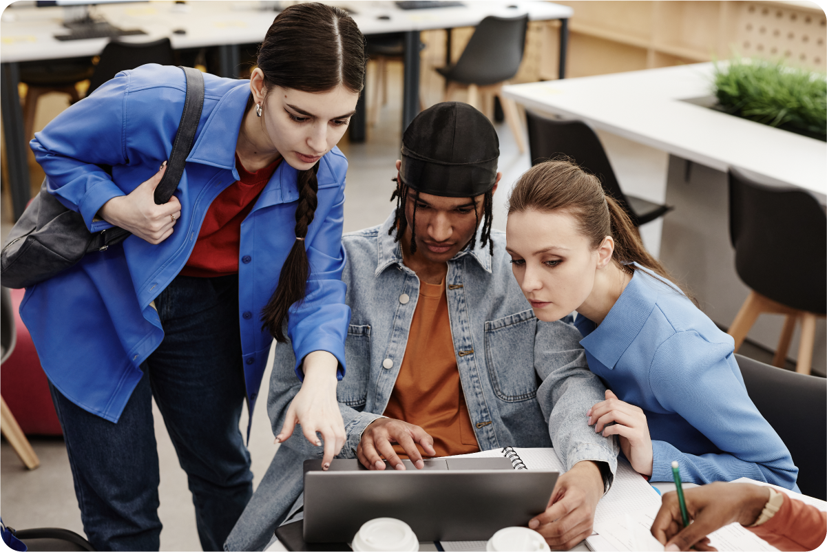 University students developing digital skills together on a laptop